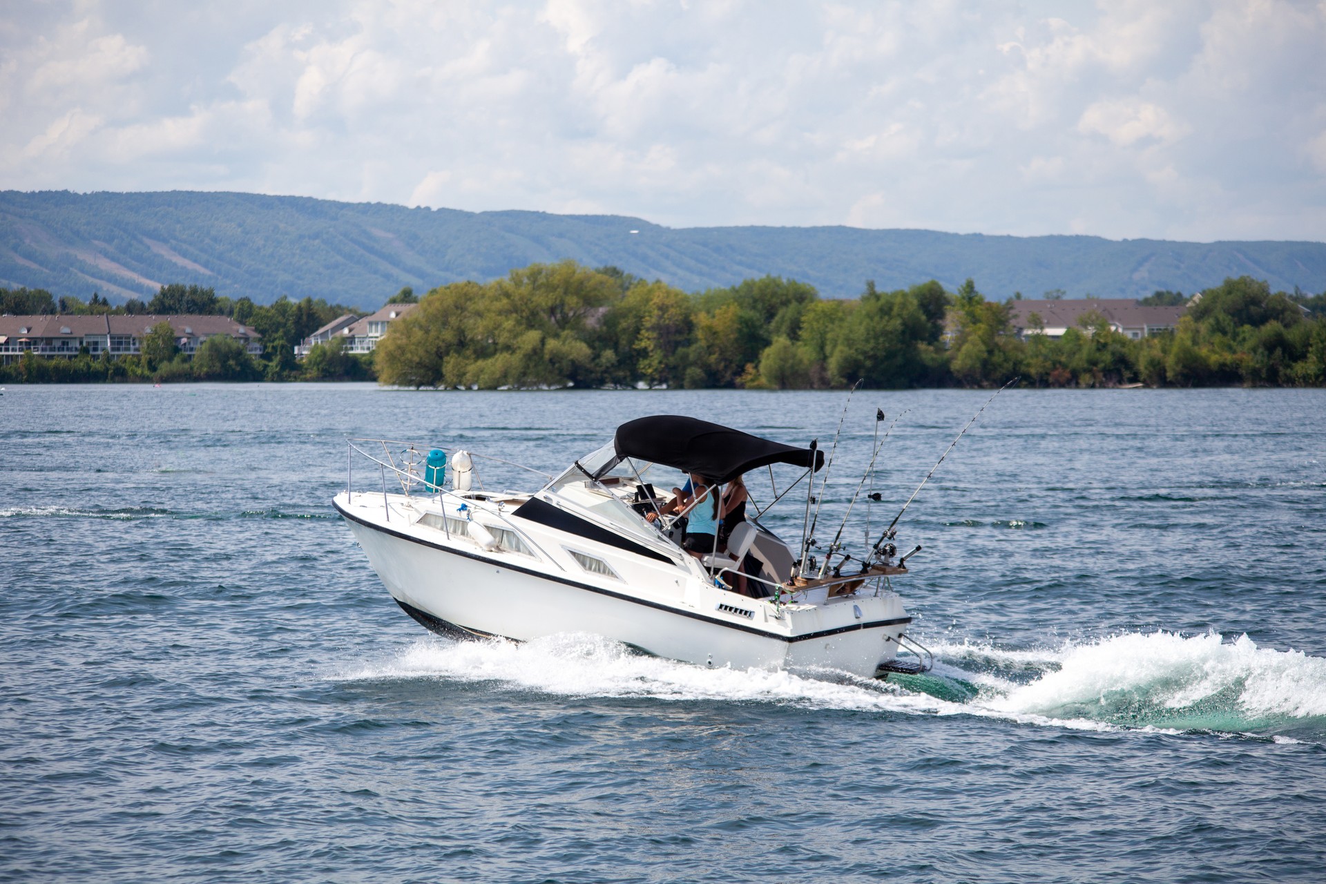 A small fishing boat returns to the Collingwood Harbor